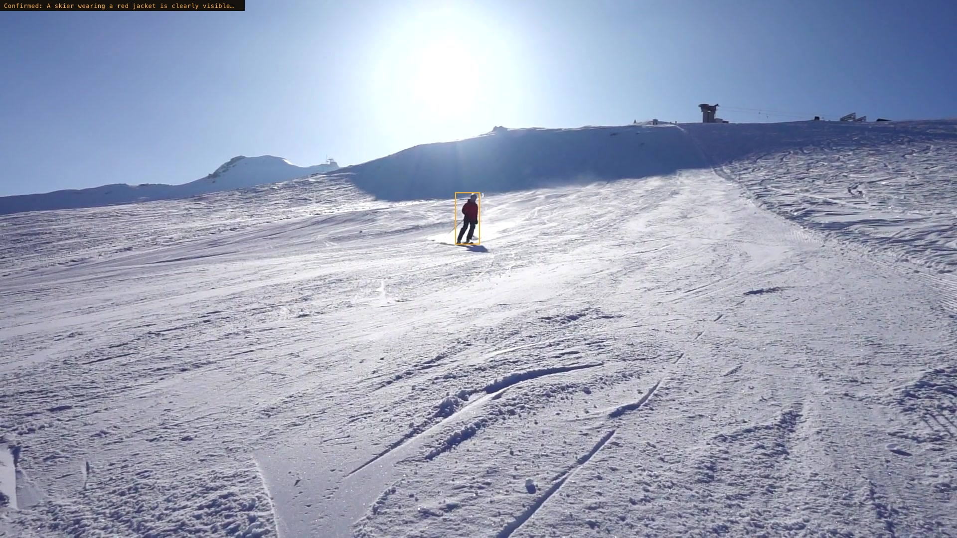 Confirmed: A skier wearing a red jacket is clearly visible…